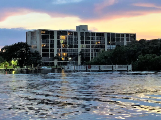 outdoor building at dusk featuring a water view