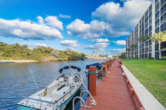 dock area featuring a yard and a water view