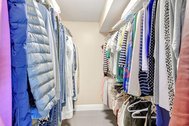 walk in closet featuring tile patterned flooring