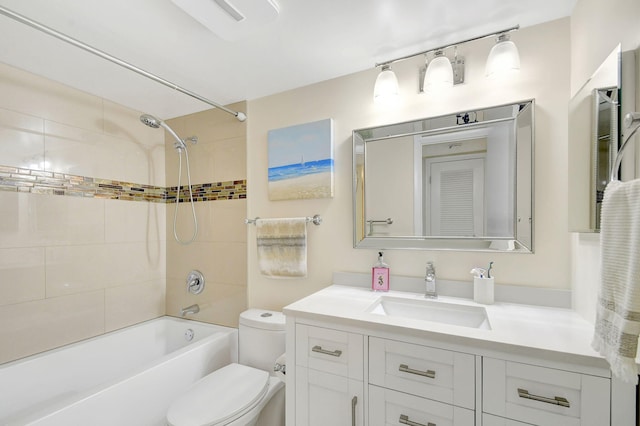 full bathroom featuring vanity, toilet, and tiled shower / bath combo