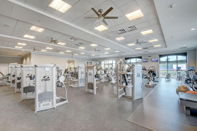 exercise room with ceiling fan and a paneled ceiling