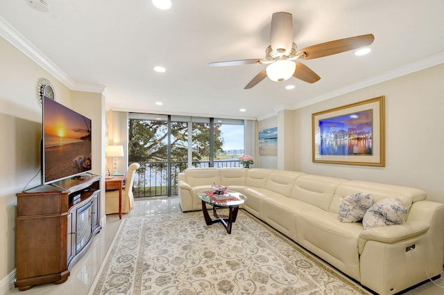 tiled living room with expansive windows, ceiling fan, and ornamental molding