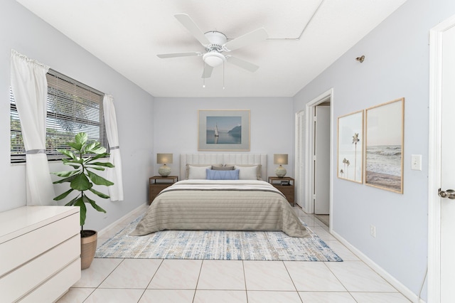 tiled bedroom featuring ceiling fan