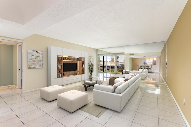 living room featuring light tile patterned floors and a textured ceiling