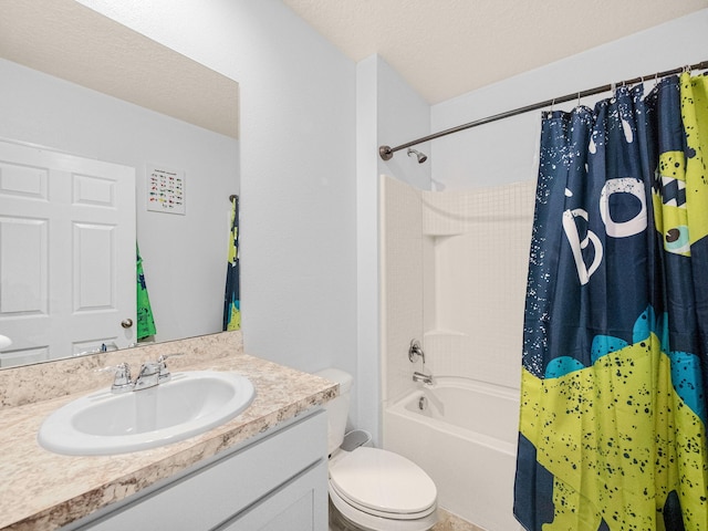 full bathroom featuring vanity, a textured ceiling, shower / bath combination with curtain, and toilet