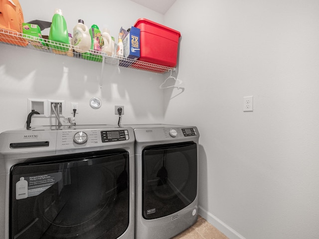 clothes washing area with independent washer and dryer