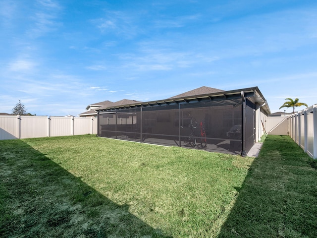 view of yard featuring a sunroom