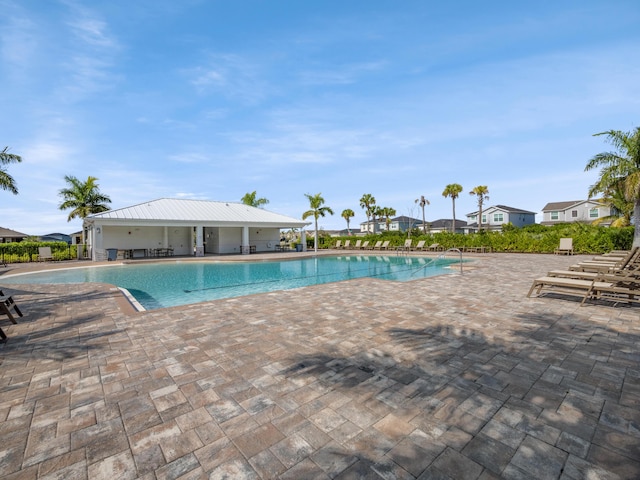 view of swimming pool with a patio