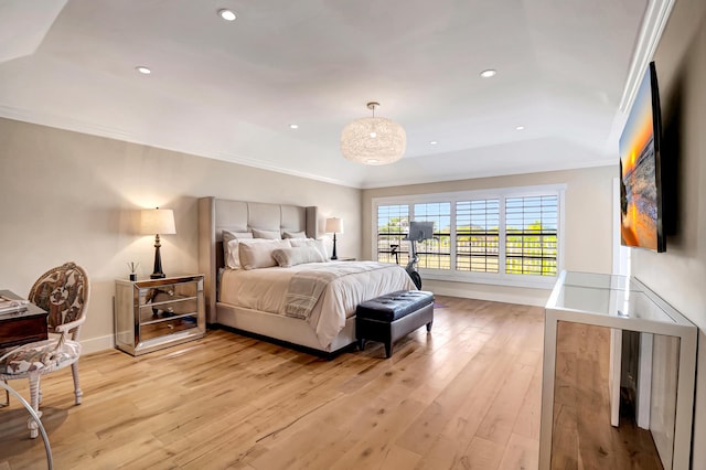 bedroom with light hardwood / wood-style flooring and ornamental molding