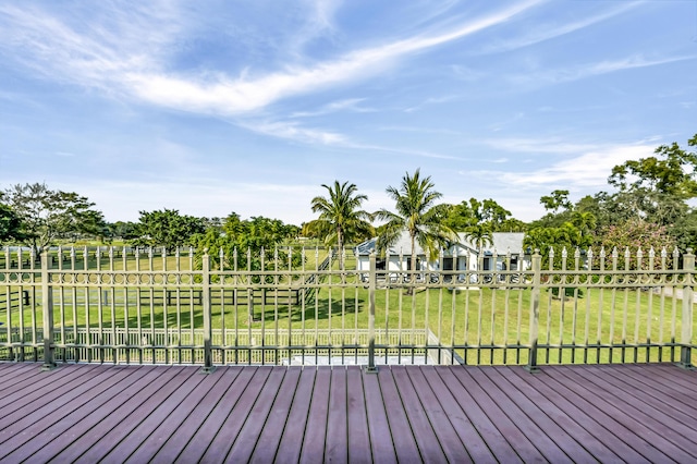 wooden terrace with a lawn