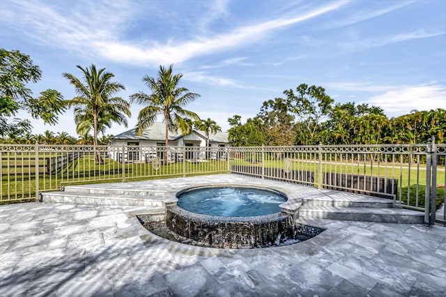 view of swimming pool featuring a yard, a patio, and an in ground hot tub