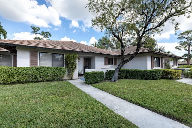 ranch-style house with a front lawn