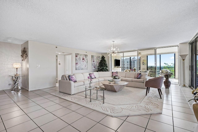 living room with light tile patterned floors, a textured ceiling, floor to ceiling windows, and a chandelier