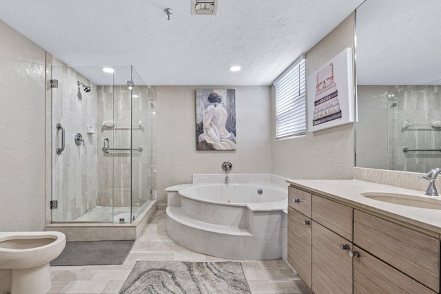 bathroom featuring vanity, shower with separate bathtub, a textured ceiling, and a bidet