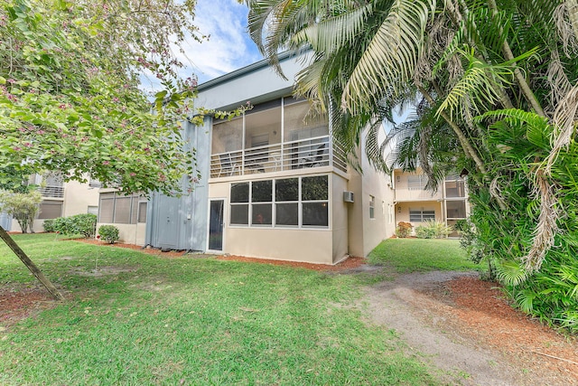 877 Flanders S, Delray Beach, FL 33484 - rear view of house with a lawn