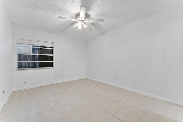 unfurnished room featuring a textured ceiling, ceiling fan, and light tile patterned flooring