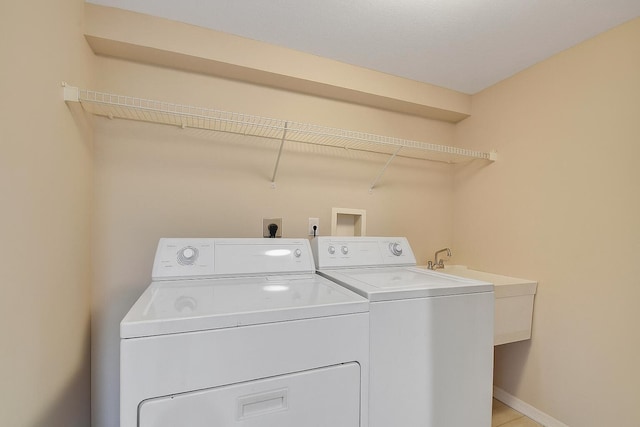 12560 Majesty Cir Unit 401, Boynton Beach, FL 33437 - laundry room with washer and dryer and baseboards