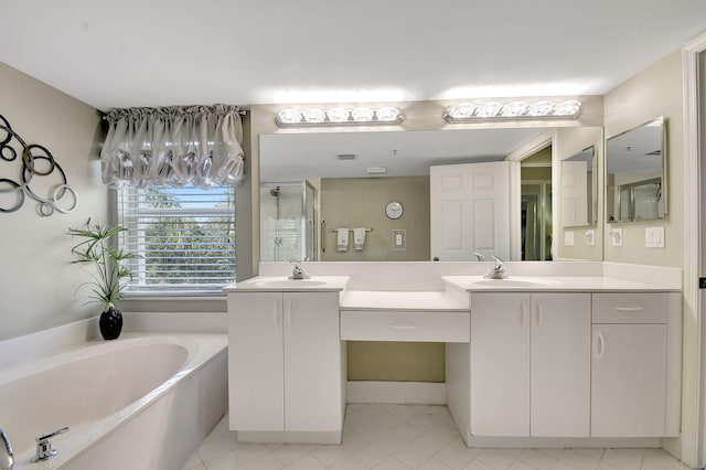 bathroom featuring vanity and shower with separate bathtub