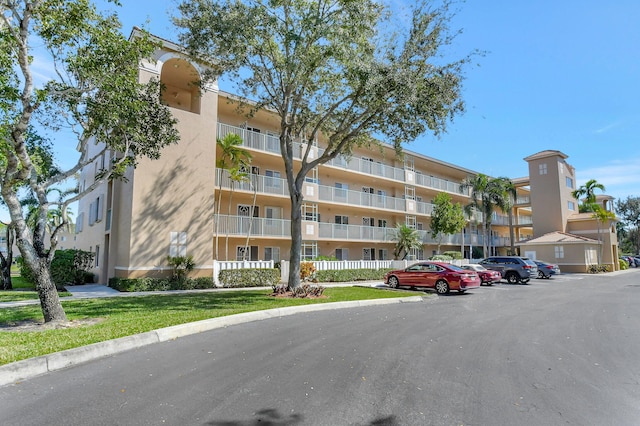 12560 Majesty Cir Unit 401, Boynton Beach, FL 33437 - view of apartment building / complex with uncovered parking