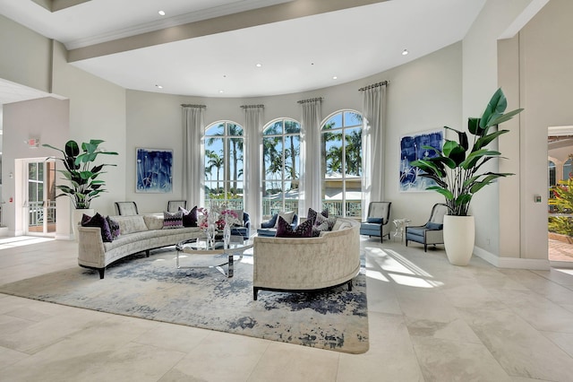 living room featuring a towering ceiling