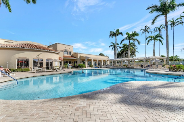 12560 Majesty Cir Unit 401, Boynton Beach, FL 33437 - community pool featuring a patio area