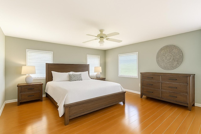 12560 Majesty Cir Unit 401, Boynton Beach, FL 33437 - bedroom featuring light wood-style floors and a ceiling fan