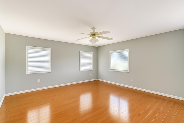 12560 Majesty Cir Unit 401, Boynton Beach, FL 33437 - empty room with ceiling fan and wood finished floors