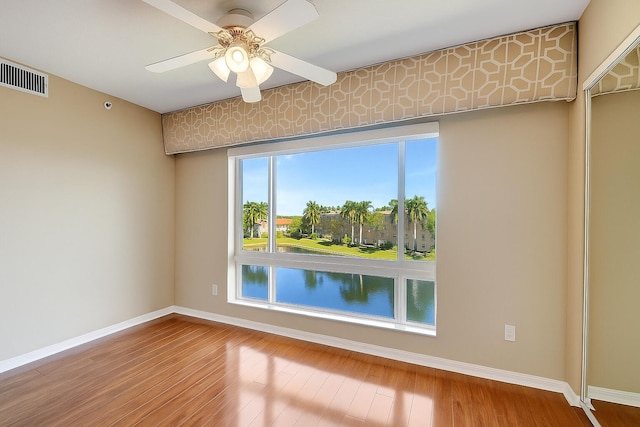 12560 Majesty Cir Unit 401, Boynton Beach, FL 33437 - spare room with wood finished floors and a ceiling fan