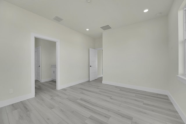 unfurnished room featuring light wood-type flooring