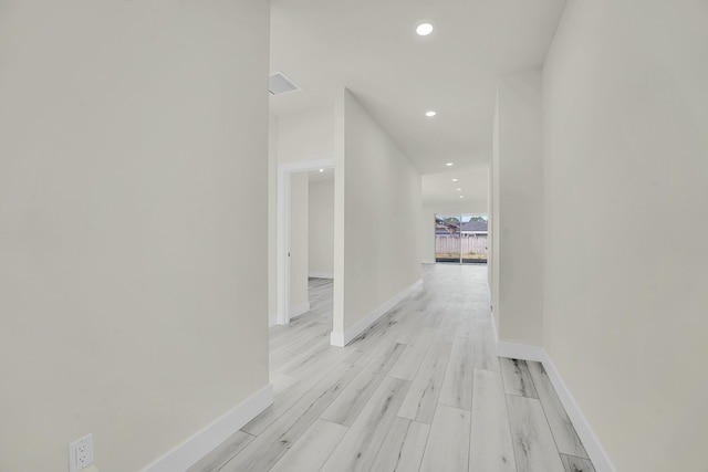 hall with light hardwood / wood-style floors