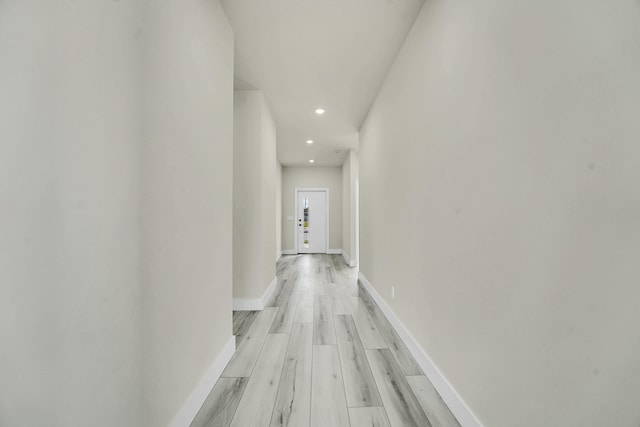 hall with light hardwood / wood-style floors