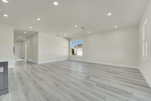 unfurnished room featuring light wood-type flooring