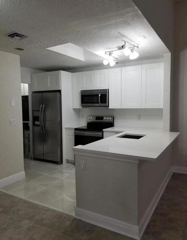 kitchen with white cabinetry, kitchen peninsula, electric range, and black refrigerator with ice dispenser