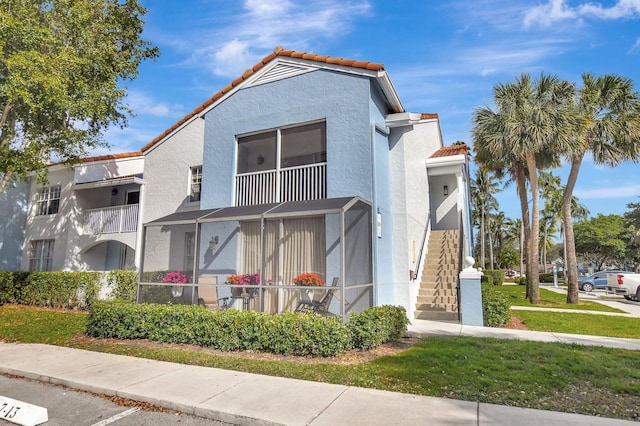 view of front of property with a balcony