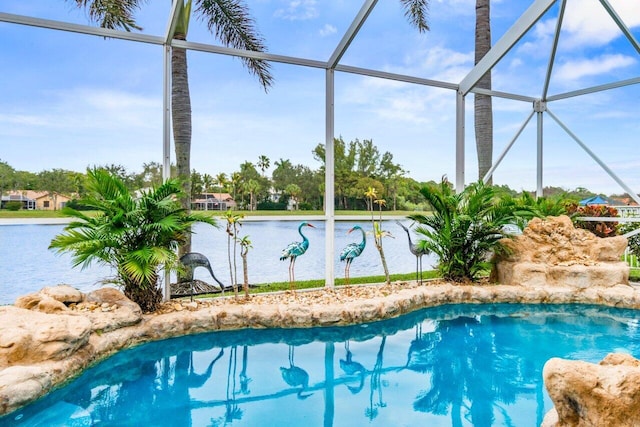 view of pool with a water view and a lanai