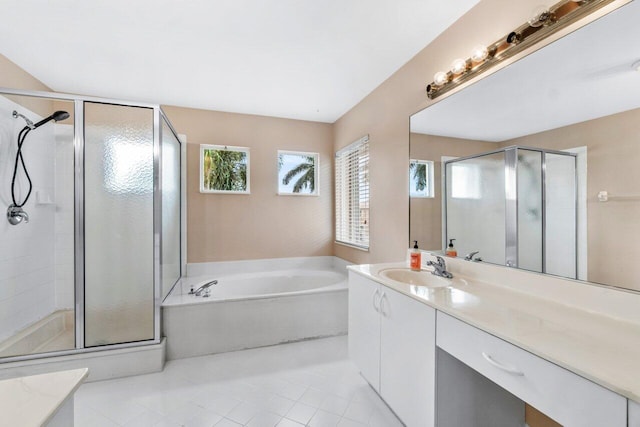 bathroom featuring vanity, tile patterned floors, and shower with separate bathtub