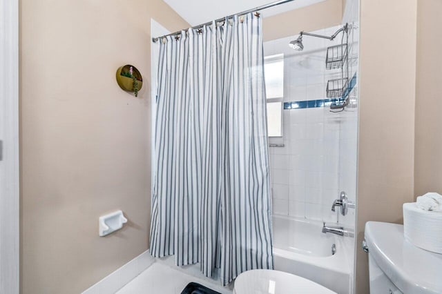 bathroom featuring tile patterned floors, toilet, and shower / bath combo