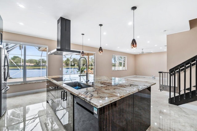 kitchen featuring sink, light stone counters, a large island with sink, pendant lighting, and island exhaust hood