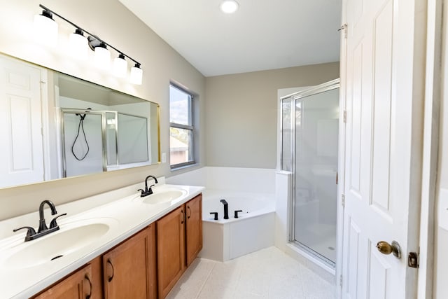 bathroom with a shower stall, a bath, and a sink