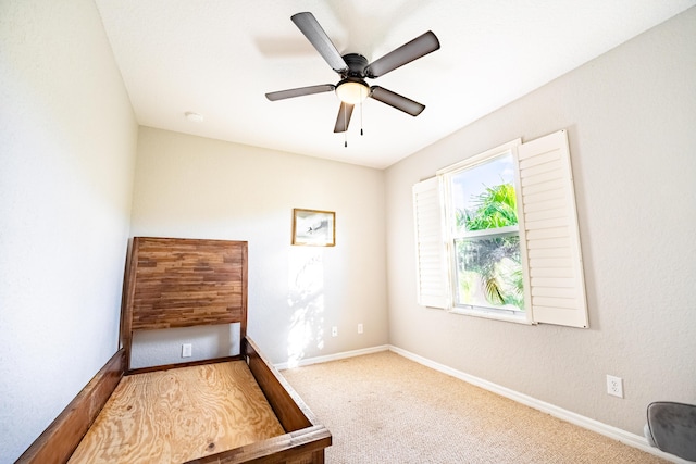 unfurnished bedroom featuring ceiling fan and carpet floors