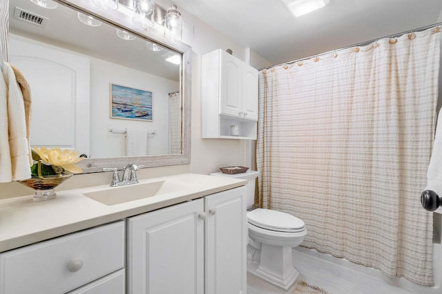 bathroom with vanity, toilet, and a shower with shower curtain