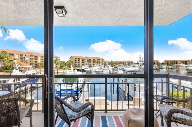 balcony featuring a water view