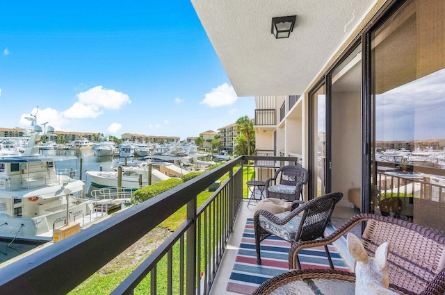 balcony featuring a water view