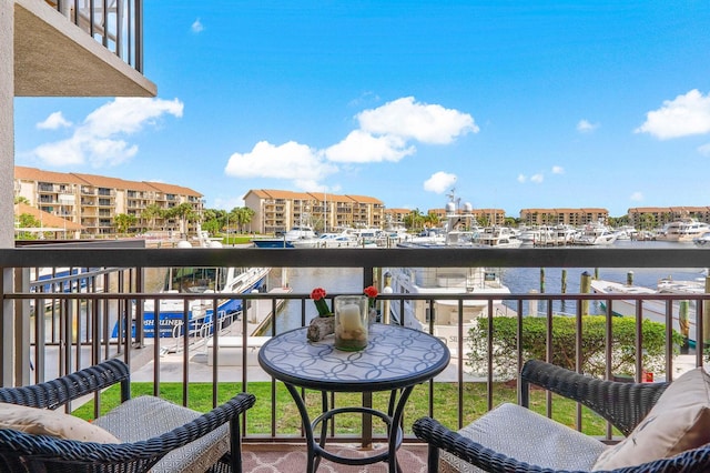 balcony featuring a water view