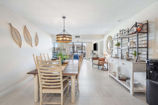 dining room with a textured ceiling