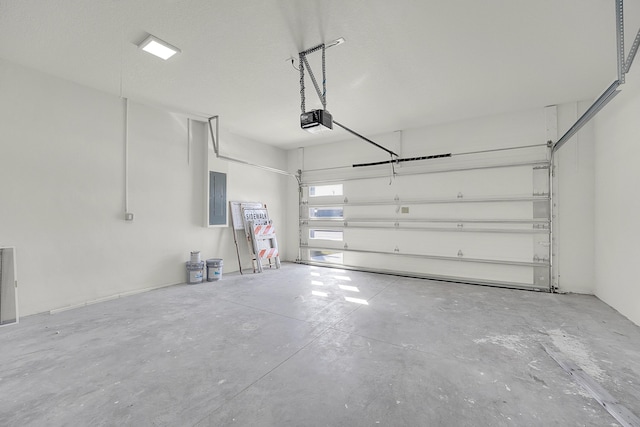 garage featuring a garage door opener and electric panel