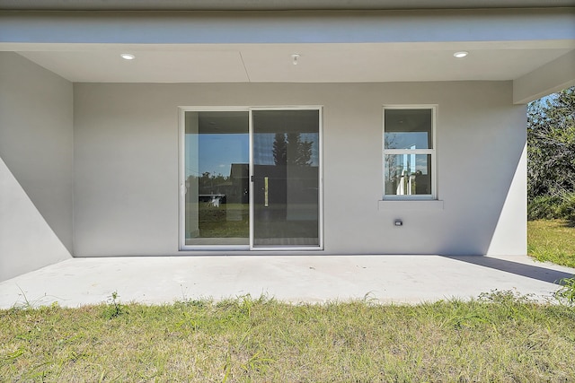 back of property with a patio area