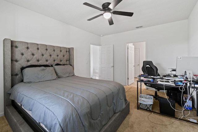 bedroom featuring light carpet, visible vents, and a ceiling fan