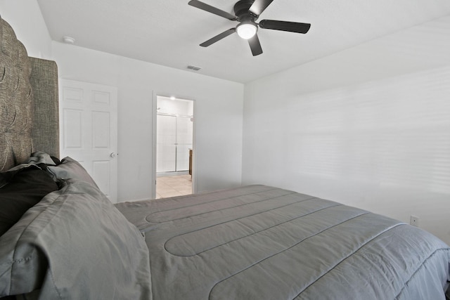 bedroom featuring ceiling fan, connected bathroom, and visible vents