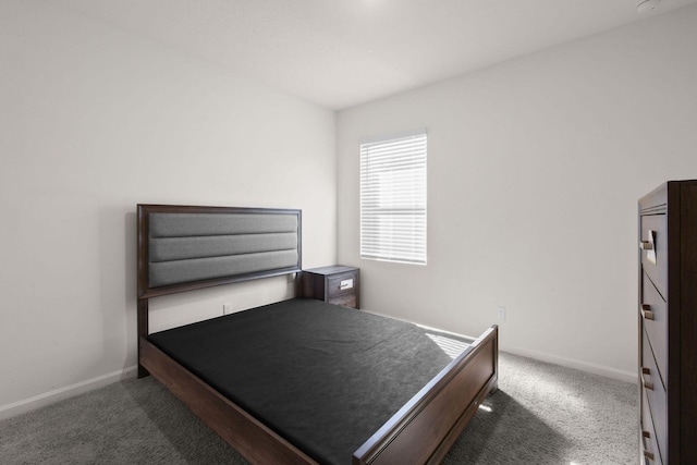 carpeted bedroom featuring baseboards